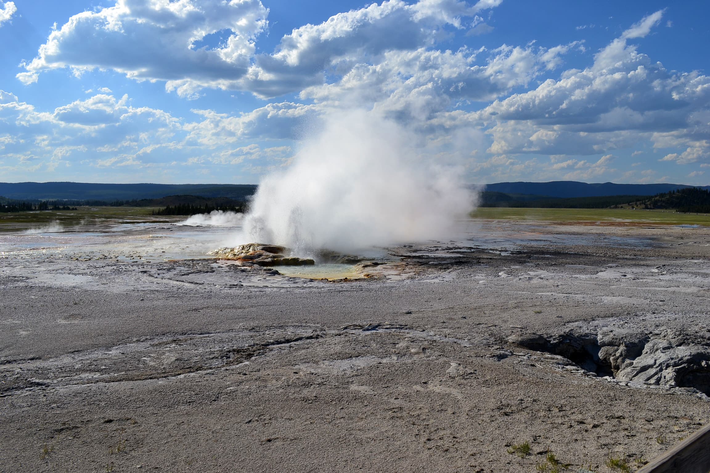Geyser erupting in Yellowstone, first photo in a series showing an eruption.